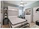 Second bedroom featuring a Murphy bed and built-in shelving when not in use at 2941 Marlberry Ln, Clermont, FL 34714