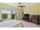 Bedroom with large window, providing ample natural light and serene pond view at 2941 Marlberry Ln, Clermont, FL 34714