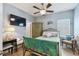Cozy bedroom with ceiling fan, decorative touches, and ample natural light at 2941 Marlberry Ln, Clermont, FL 34714