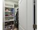 Organized closet with shelves, hanging rods, and ample storage at 2941 Marlberry Ln, Clermont, FL 34714