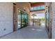 View from the club room entrance out towards the pool area through an iron fence at 2941 Marlberry Ln, Clermont, FL 34714