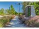 Serenoa neighborhood signage alongside a sidewalk lined with trees and native grasses at 2941 Marlberry Ln, Clermont, FL 34714