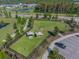Aerial shot of a dog park with benches, shade, and play areas at 2941 Marlberry Ln, Clermont, FL 34714