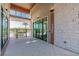 View of the fitness center entry featuring glass doors, stacked stone, and fitness signage at 2941 Marlberry Ln, Clermont, FL 34714