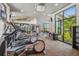 Modern community gym showcasing state-of-the-art exercise equipment and ample natural light for a comfortable workout experience at 2941 Marlberry Ln, Clermont, FL 34714