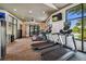 Well-equipped gym featuring cardio machines, large windows, and poolside views at 2941 Marlberry Ln, Clermont, FL 34714