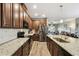 Open kitchen featuring granite counters, stainless appliances, and hardwood floors at 2941 Marlberry Ln, Clermont, FL 34714