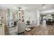 Inviting living room boasts wood-look floors, neutral paint and ample natural light at 2941 Marlberry Ln, Clermont, FL 34714