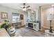 Cozy living area features wood-look floors, neutral tones, and a stylish decor at 2941 Marlberry Ln, Clermont, FL 34714