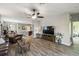 Spacious living room with hardwood floors and ceiling fan is perfect for entertaining and relaxation at 2941 Marlberry Ln, Clermont, FL 34714