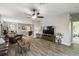 Spacious living room with hardwood floors, ceiling fan, and open floor plan at 2941 Marlberry Ln, Clermont, FL 34714