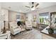 Spacious living area offering wood-look floors, two armchairs and stylish decor at 2941 Marlberry Ln, Clermont, FL 34714