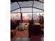 Relaxing screened patio with sunset views and comfortable seating, perfect for enjoying the outdoors at 2941 Marlberry Ln, Clermont, FL 34714