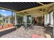 Enjoy outdoor living on this large screened-in patio with comfortable seating and a view of the lush backyard at 2941 Marlberry Ln, Clermont, FL 34714