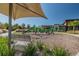 Shaded playground with a variety of play equipment and lush landscaping nearby at 2941 Marlberry Ln, Clermont, FL 34714