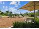 Community playground area includes various play structures and a bench seating area, perfect for relaxing and watching the play at 2941 Marlberry Ln, Clermont, FL 34714