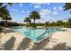 Community pool featuring multiple swimming lanes, surrounding seating, and clear blue water for a refreshing experience at 2941 Marlberry Ln, Clermont, FL 34714