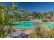 Community splash pad with water features, lounge chairs and palm trees at 2941 Marlberry Ln, Clermont, FL 34714