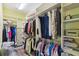 Walk-in closet with ample storage space and custom shelving at 2941 Marlberry Ln, Clermont, FL 34714