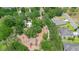 Aerial view of a community playground nestled among mature trees, near walking trails and neighborhood homes at 30245 Cheval St, Mount Dora, FL 32757