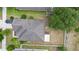 Aerial view of a home featuring mature trees, large roof, and a spacious backyard at 30245 Cheval St, Mount Dora, FL 32757