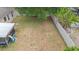 Aerial view of large backyard with mature trees, privacy fence, and screened in patio area at 30245 Cheval St, Mount Dora, FL 32757