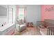 Bright bedroom with plush pink carpet, pastel colored dresser and a window with natural light at 30245 Cheval St, Mount Dora, FL 32757