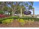 Entrance to Sullivan Ranch, Mount Dora, featuring signage, landscaping, and decorative stonework at 30245 Cheval St, Mount Dora, FL 32757