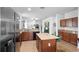 Kitchen area with island, granite countertops, stainless steel appliances, and open floor plan at 30245 Cheval St, Mount Dora, FL 32757