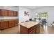 Kitchen area featuring granite countertops, wood cabinets, an island and breakfast nook at 30245 Cheval St, Mount Dora, FL 32757