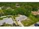 A beautiful aerial shot of a cozy single Gathering home surrounded by lush greenery and a well-maintained lawn at 3104 Lime Tree Dr, Edgewater, FL 32141