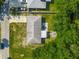 An aerial view of the home showing backyard fire pit and patio off the back of the home at 3104 Lime Tree Dr, Edgewater, FL 32141