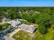 Charming single-story home with a spacious yard, surrounded by lush greenery and mature trees, offering privacy at 3104 Lime Tree Dr, Edgewater, FL 32141