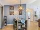 Cozy dining area with stylish furniture, wood floors, decorative artwork, and inviting atmosphere at 3104 Lime Tree Dr, Edgewater, FL 32141