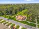 Aerial view of a playground and walking path with nearby townhomes and lush green spaces, ideal for families at 3206 Water Sprite St, Orlando, FL 32808