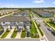 Community aerial view featuring modern townhomes, lush landscaping, and well-maintained streets at 3206 Water Sprite St, Orlando, FL 32808