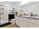 Bathroom featuring a glass-enclosed shower, modern vanity, and clean finishes at 3206 Water Sprite St, Orlando, FL 32808