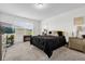 Comfortable bedroom with a plush bed, fireplace, and ample natural light at 3206 Water Sprite St, Orlando, FL 32808