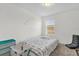 Cozy bedroom with a comfortable bed, ample natural light, and simple decor at 3206 Water Sprite St, Orlando, FL 32808