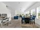 Spacious living area with an open floor plan connecting living, dining, and work spaces at 3206 Water Sprite St, Orlando, FL 32808