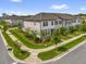 Well-manicured lawns and sidewalks add to the curb appeal of these modern townhomes at 3206 Water Sprite St, Orlando, FL 32808