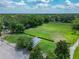 Expansive green space with mature trees, small gazebo, and recreational areas offer a serene outdoor environment at 3213 Kentshire Blvd, Ocoee, FL 34761