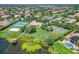 Gorgeous aerial view of community amenities including tennis and basketball courts, playground, and lake access at 3213 Kentshire Blvd, Ocoee, FL 34761
