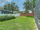 Spacious backyard with lush lawn and privacy fence, perfect for outdoor activities at 3213 Kentshire Blvd, Ocoee, FL 34761