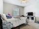 Bedroom featuring a bed, desk, and storage cubes at 3213 Kentshire Blvd, Ocoee, FL 34761