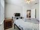 Bedroom featuring a bed, desk, and television at 3213 Kentshire Blvd, Ocoee, FL 34761