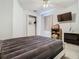 Bedroom featuring a closet, ceiling fan, and window providing a comfortable and functional space at 3213 Kentshire Blvd, Ocoee, FL 34761