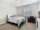 Bedroom featuring a bed, desk, and window at 3213 Kentshire Blvd, Ocoee, FL 34761