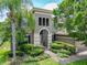 Charming two-story home featuring manicured landscaping and an inviting arched entryway at 3213 Kentshire Blvd, Ocoee, FL 34761