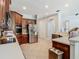 Well-equipped kitchen featuring stainless steel appliances and tile floors at 3213 Kentshire Blvd, Ocoee, FL 34761